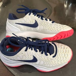 White w accents of navy blue n orange. Never worn. Was a gift.